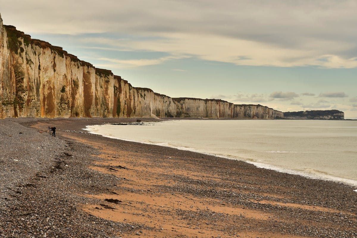 Beach Day Trips from Paris: Perfect Getaways for Sunseekers 2 French seaside beach destination near Paris with charming coastal village and azure water views