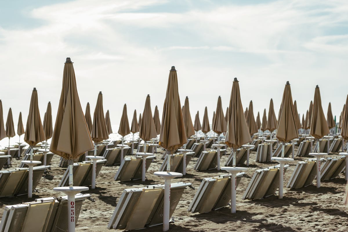 Beach Day Trips from Rome: Discover Perfect Coastal Escapes 2 Scenic Lazio coastal beach near Rome showing turquoise sea and charming seaside village for day trips