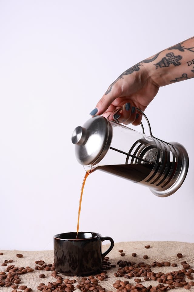 French press coffee being poured - best pre ground coffee for french press