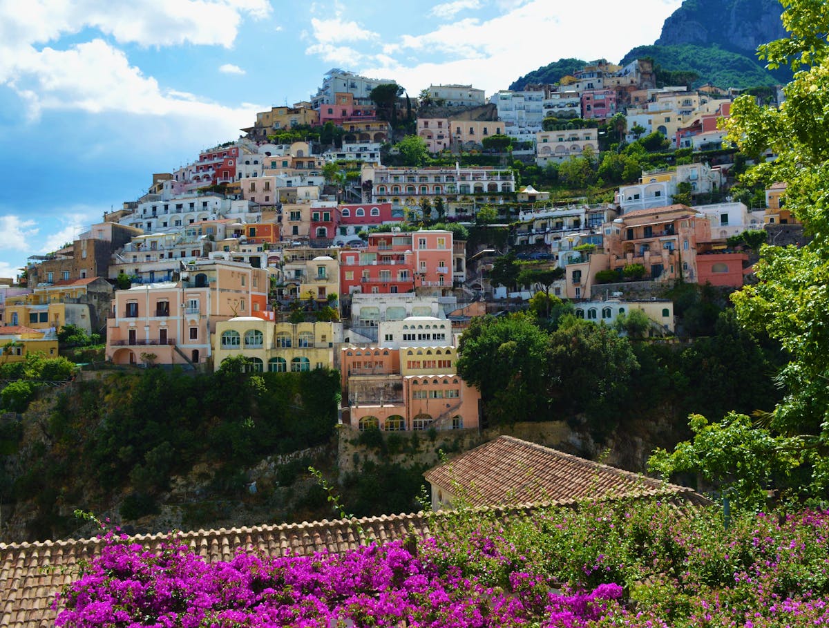 Day Trips from Positano Italy: Top Spots to Explore Nearby 2 Positano colorful buildings cascading down hillside to the Mediterranean sea perfect for exploring nearby