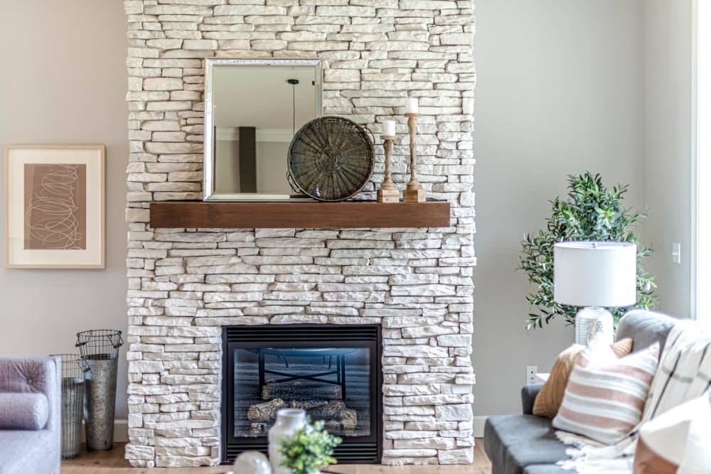 French Country Fireplace Mantels: What to Look for and How to Style Them 8 styled fireplace mantel with candlesticks and decorative mirror