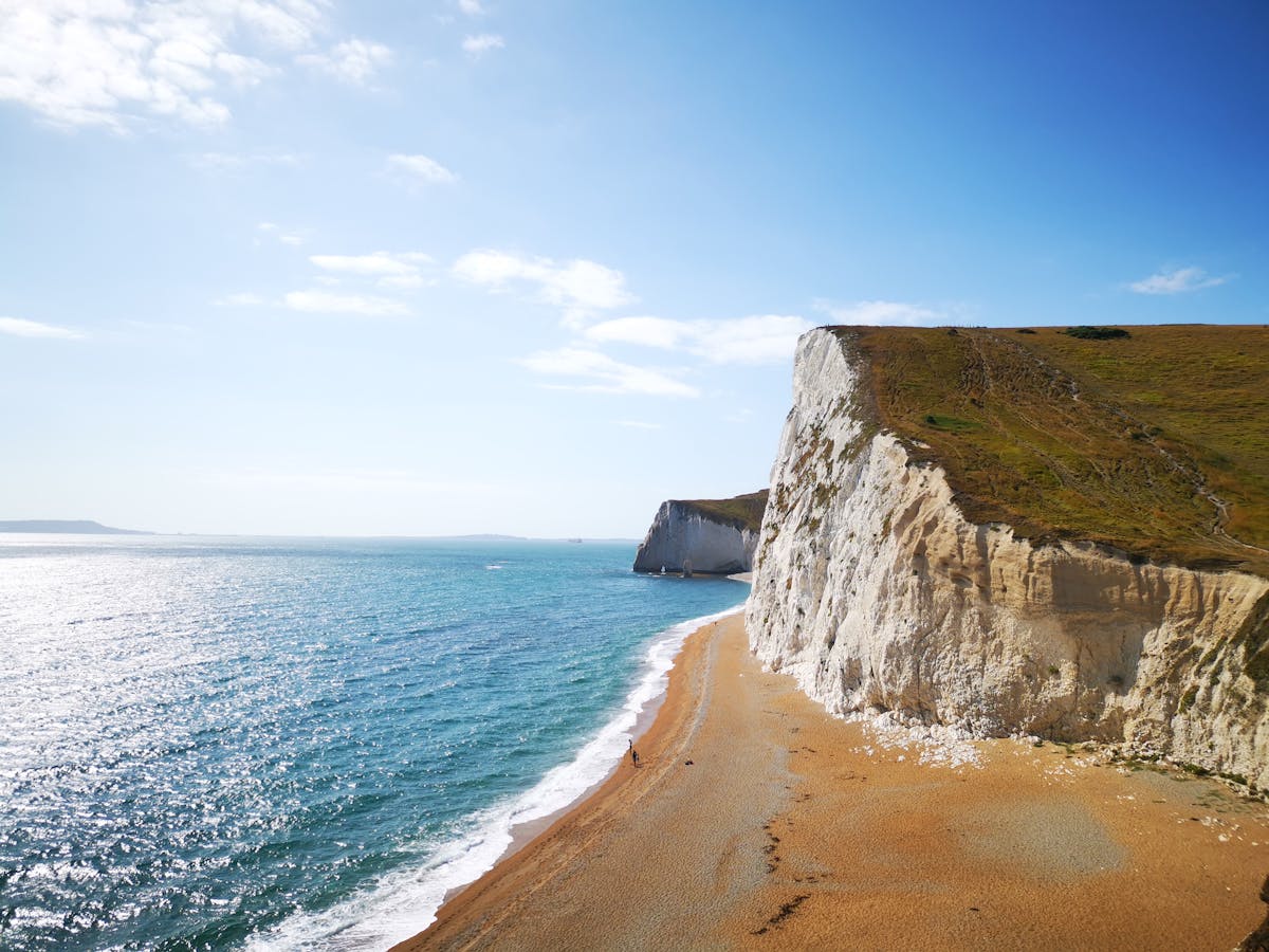 Day Trips to Isle of Wight from Portsmouth: Your Perfect Getaway 1 Isle of Wight day trip from Portsmouth, dramatic chalk coastal cliffs and sandy beach scenery