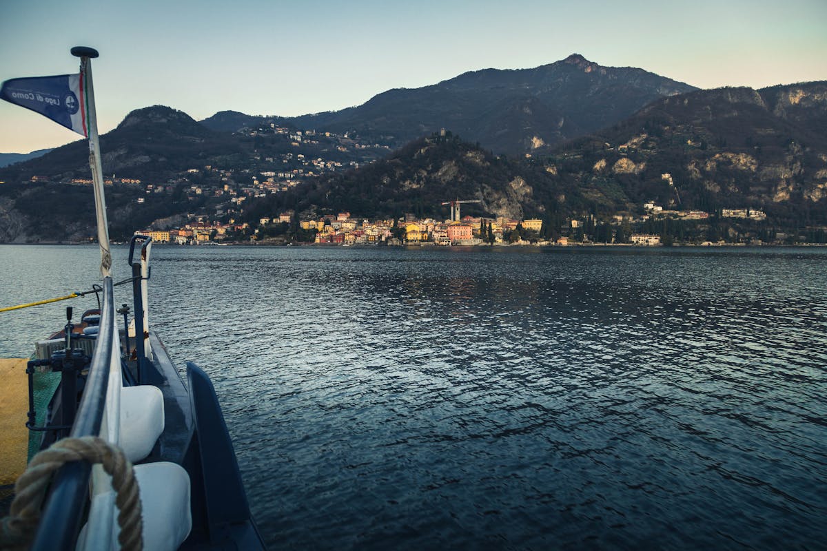 Day Trips from Lake Como to Switzerland: Top Spots to Explore 2 Lake Como Italy scenic landscape with colorful lakeside town and Swiss Alps visible in distance