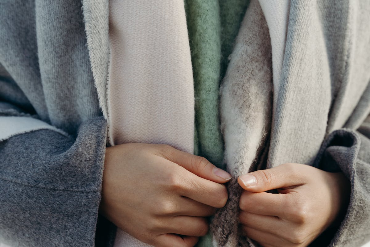 woman wearing luxury premium cashmere sweater showing superior quality