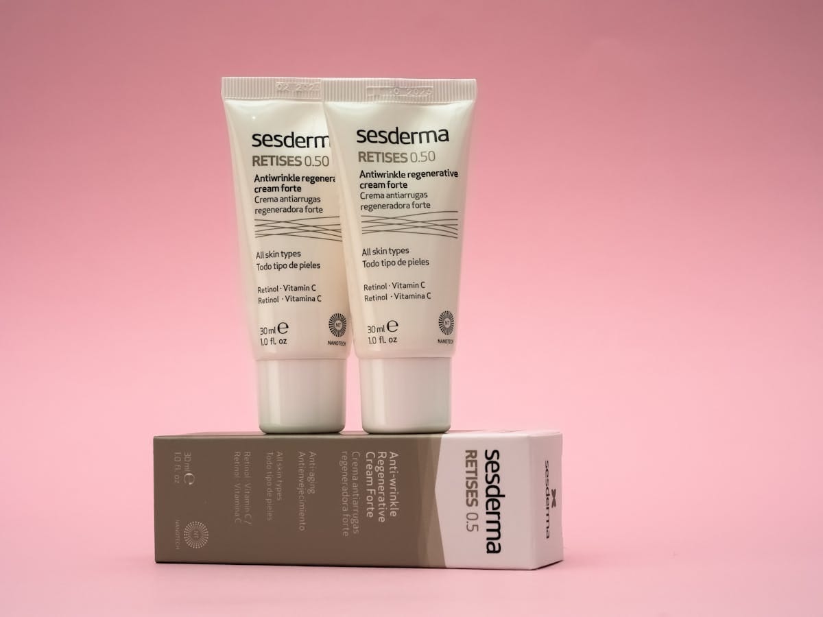 Peptides vs retinol skincare comparison, anti-aging serums and face creams side by side