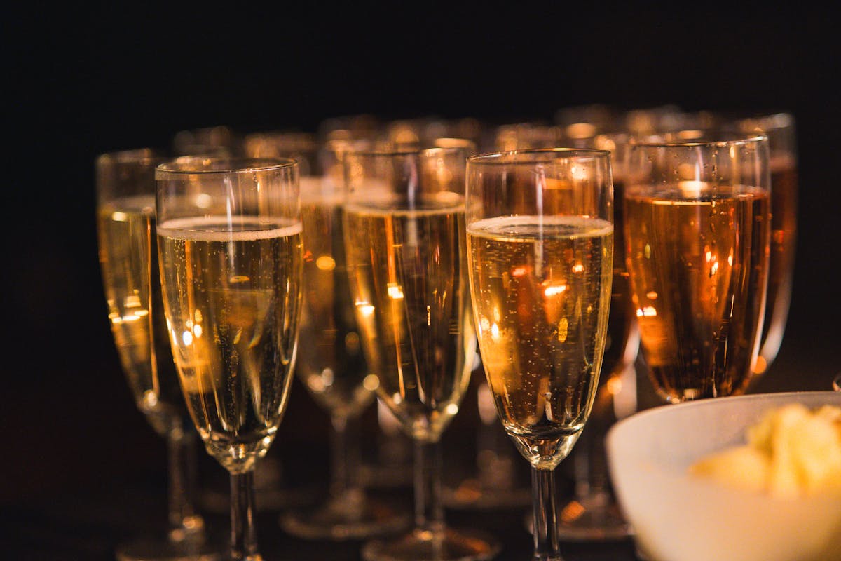 A group of champagne glasses with sparkling bubbles, perfect for a celebration.