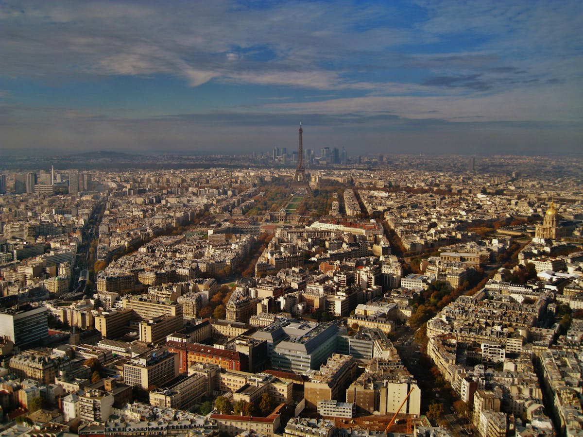 Striking aerial view of Paris featuring the iconic Eiffel Tower and urban landscape.