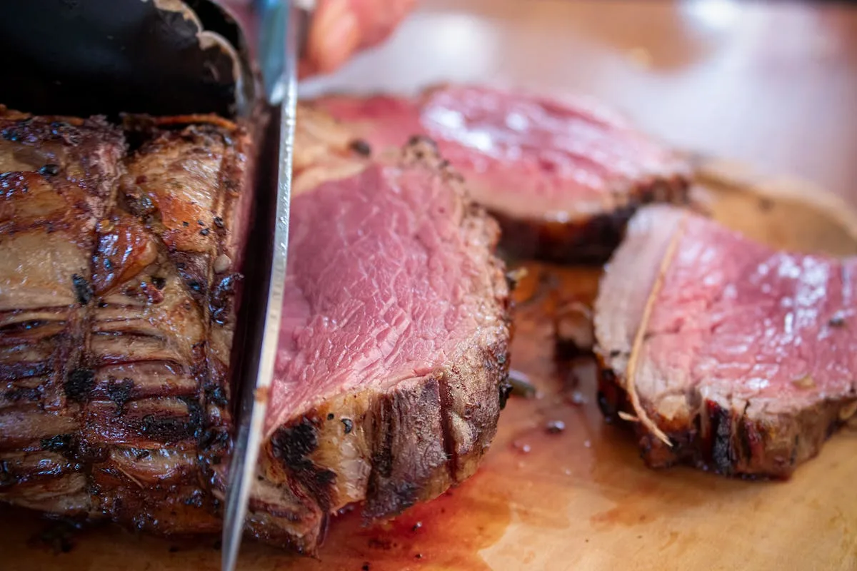Sous Vide Sirloin Tip Roast: Perfectly Tender Every Time 2 Sliced sous vide beef roast showing perfect pink interior with gourmet plating presentation