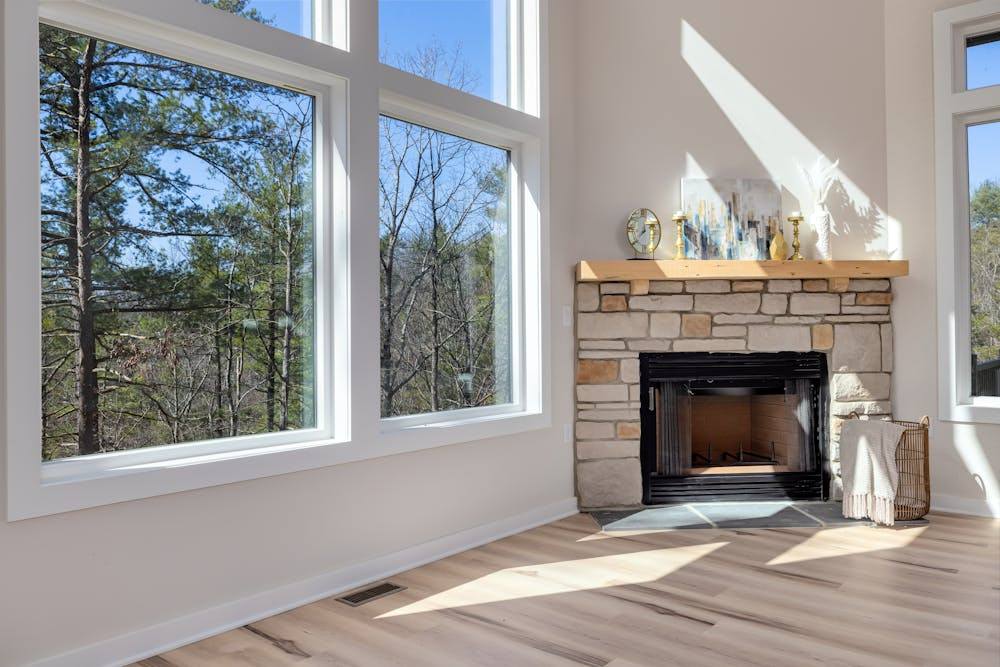 French Country Fireplace Mantels: What to Look for and How to Style Them 2 stone fireplace mantel as focal point in cozy living room