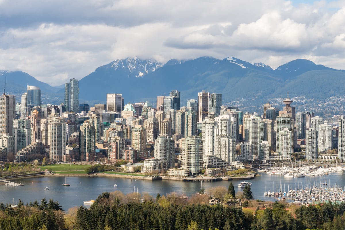 4 days in Vancouver Canada - striking city skyline with snow-capped mountains and harbor view