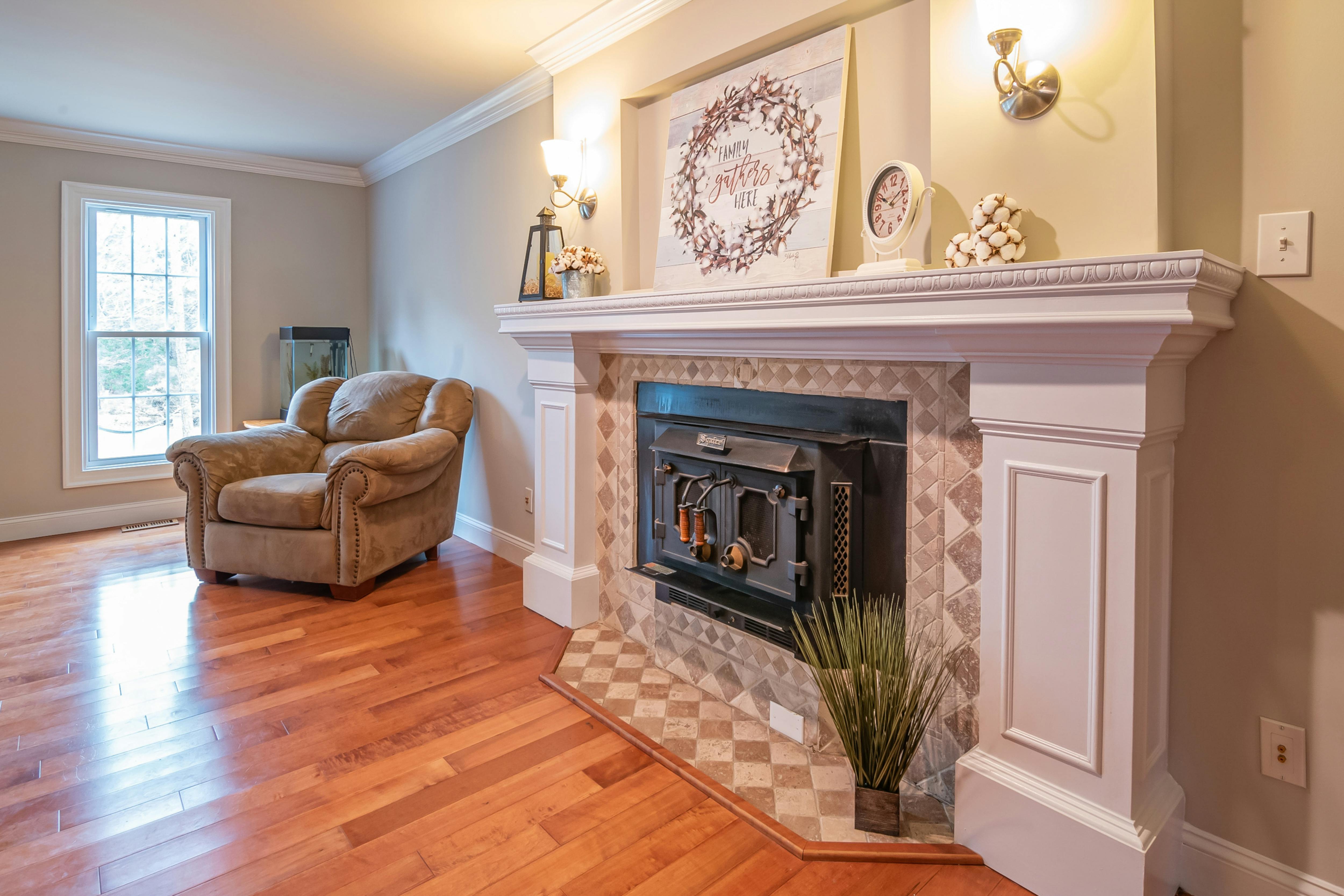 French Country Fireplace Mantels: What to Look for and How to Style Them 5 white painted wood fireplace surround with clean lines