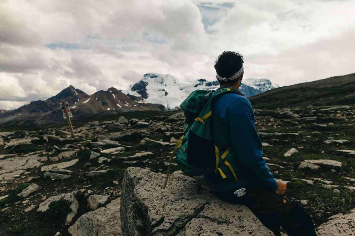 Hiker enjoying mountainous views in Jasper National Park, Alberta.