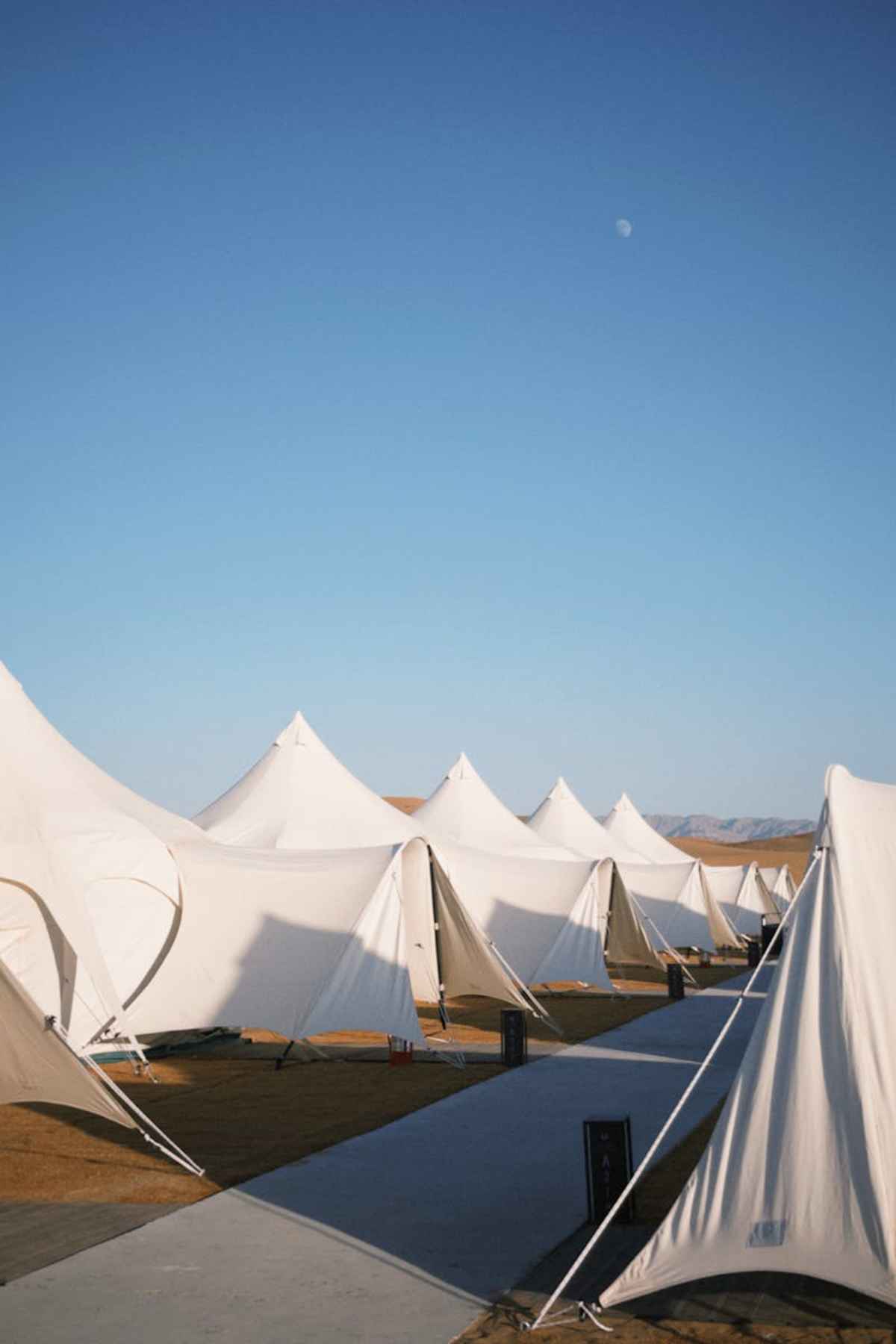 Elegant glamping tents in serene desert environment wilderness