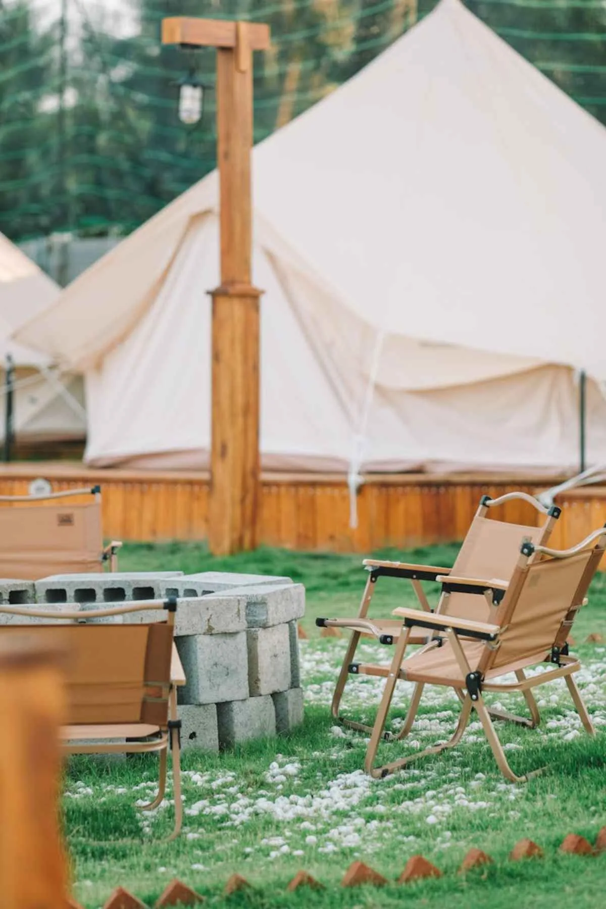 Outdoor glamping setup with tents and fire pit luxury camping