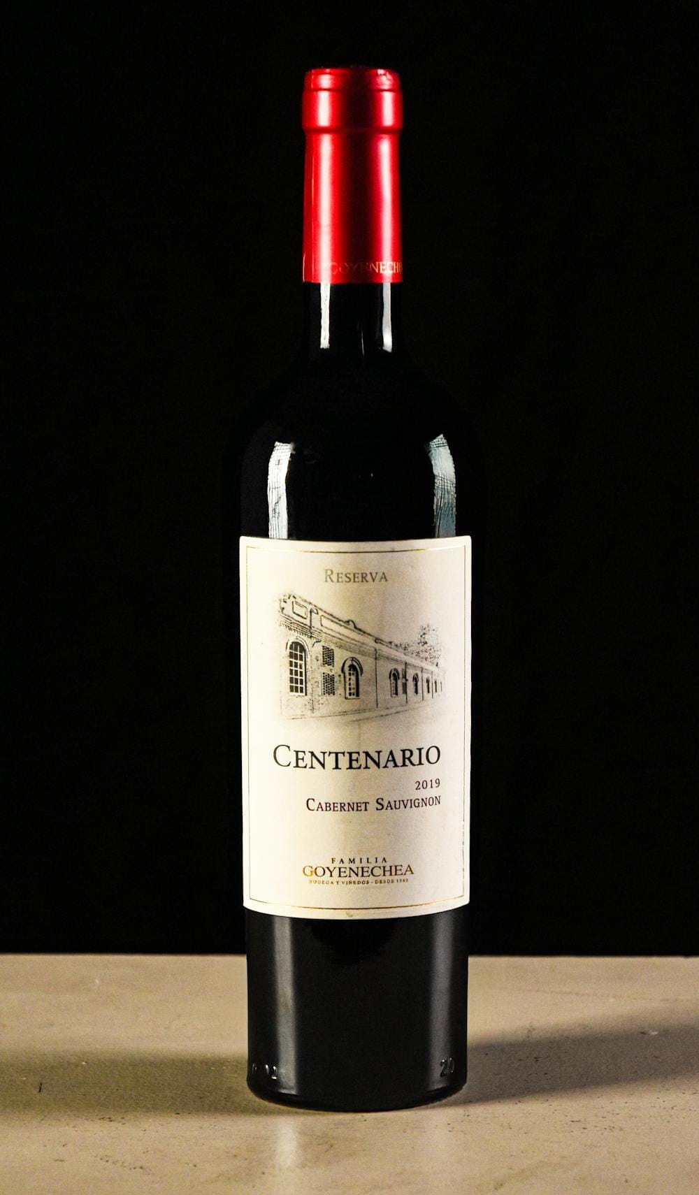 Cabernet Sauvignon Reserva wine bottle against a dark background, showcasing the iconic red wine grape variety