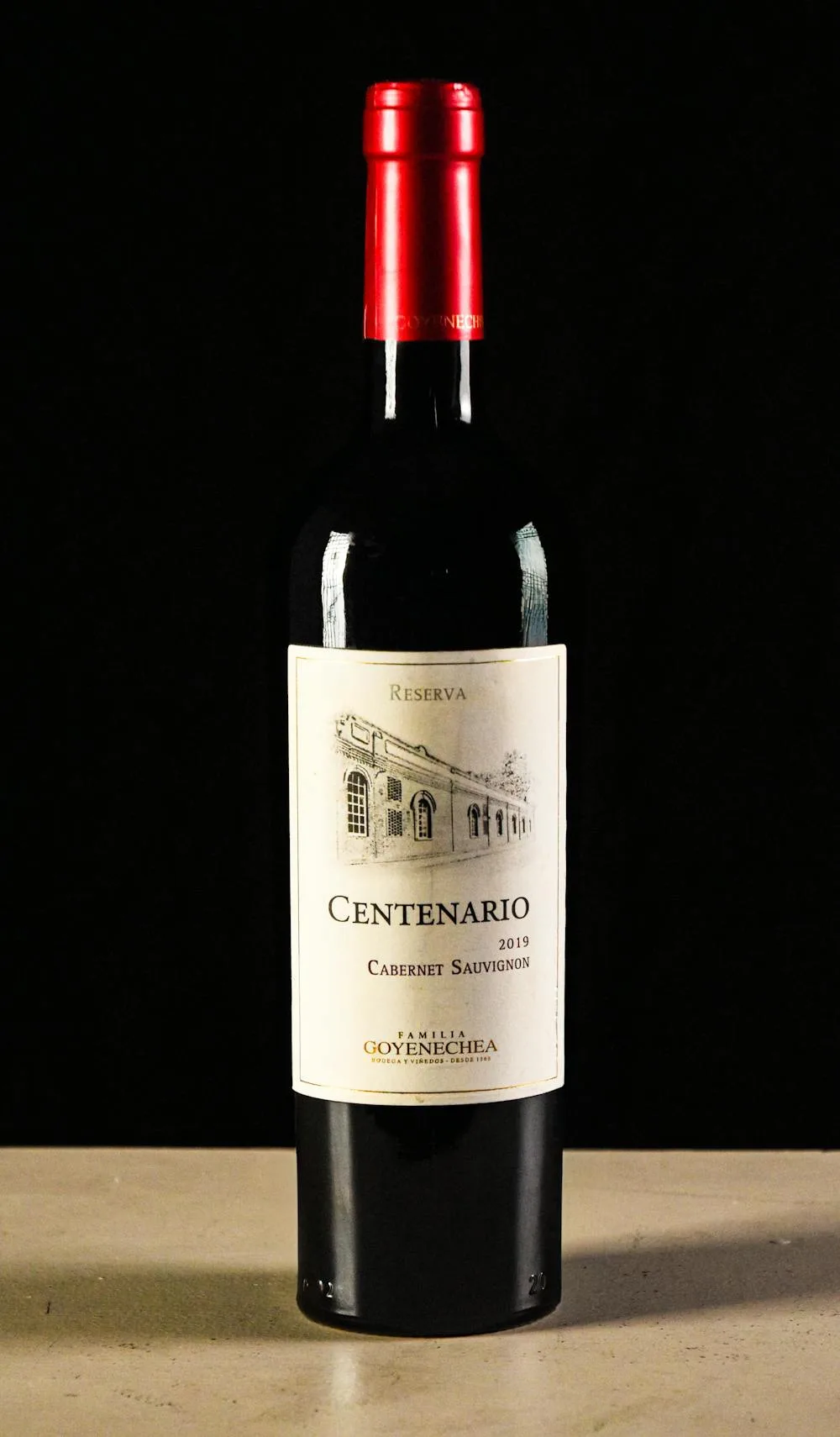 Cabernet Sauvignon Reserva wine bottle against a dark background, showcasing the iconic red wine grape variety