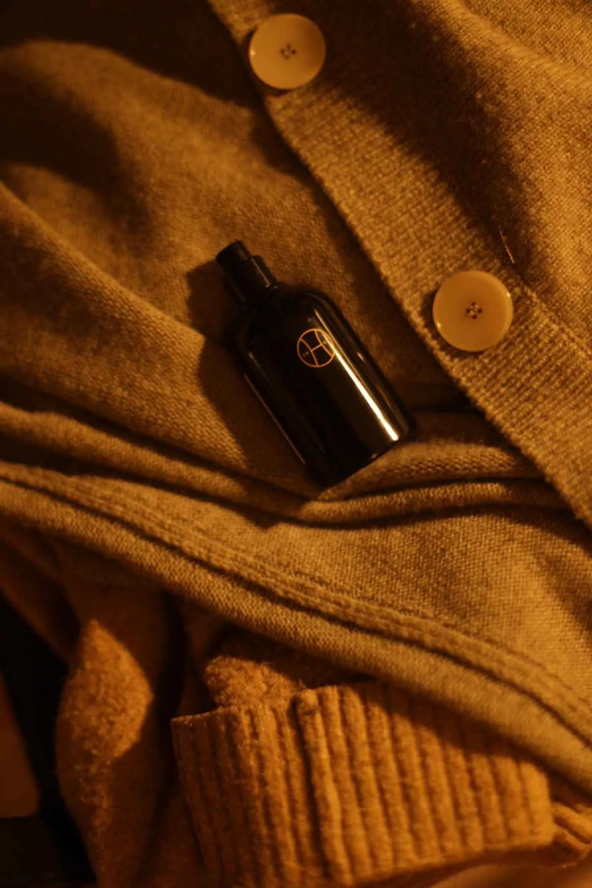 Luxury knitwear perfume soft cashmere warm earthy tones
