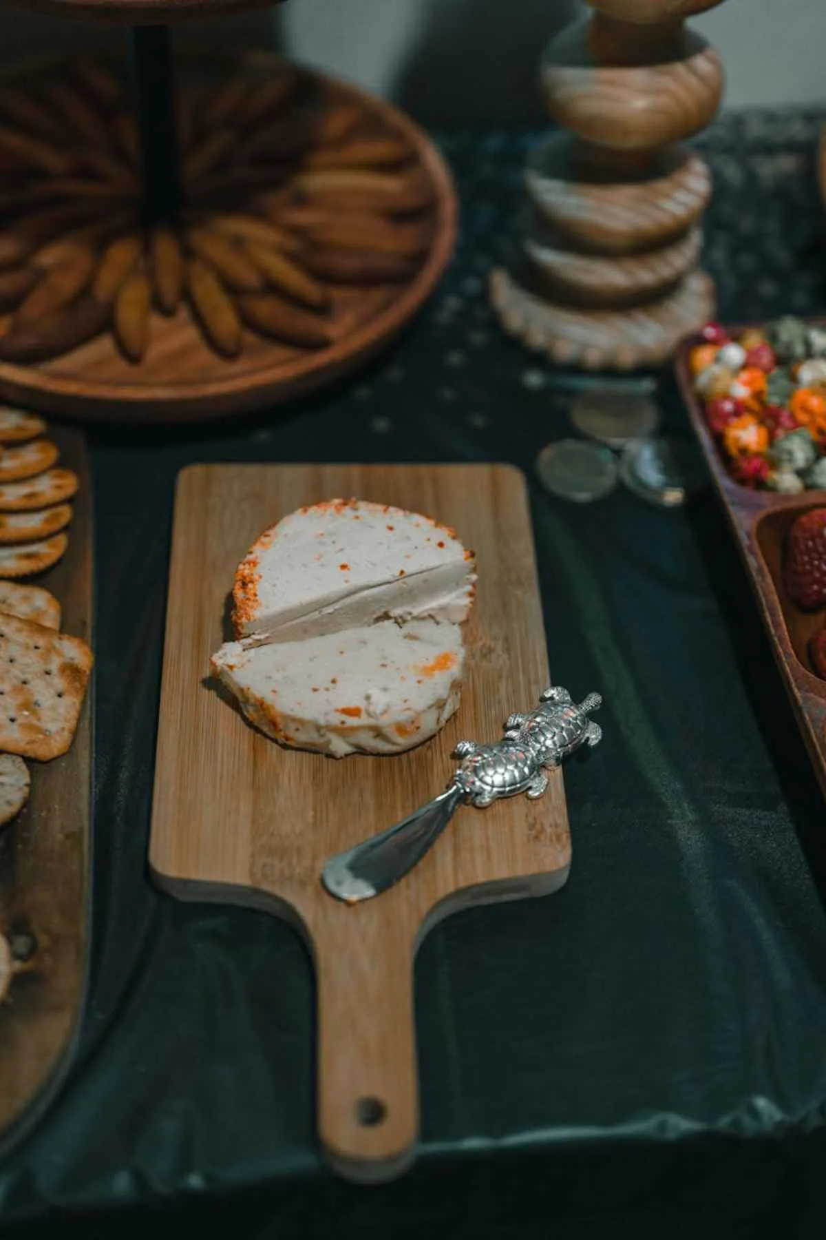 Cheese board with assorted cheeses olives figs elegant