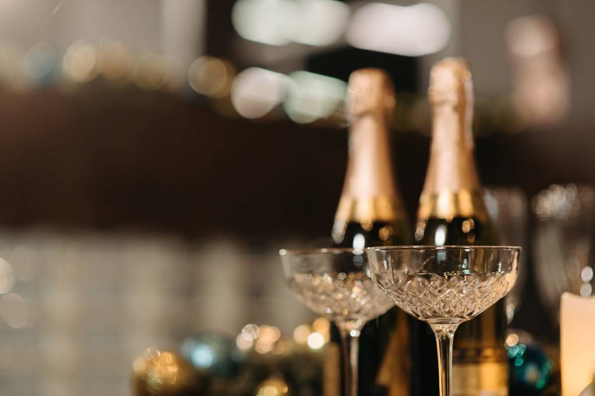 champagne flutes glowing at celebration showing how to store sparkling wine