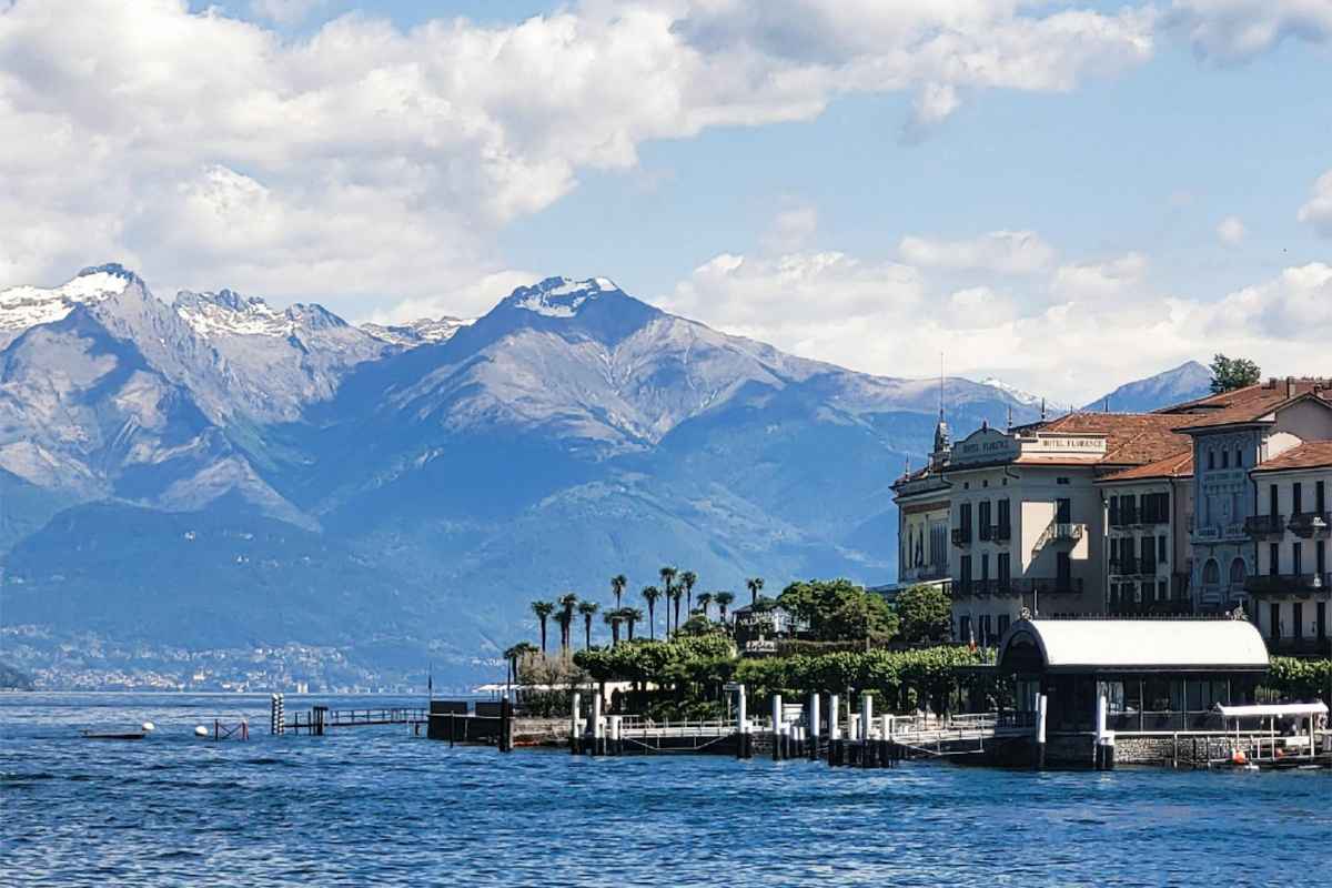 Day Trips from Lake Como to Switzerland: Top Spots to Explore 1 Picturesque view of Bellagio with mountains and Lake Como under a bright blue sky.