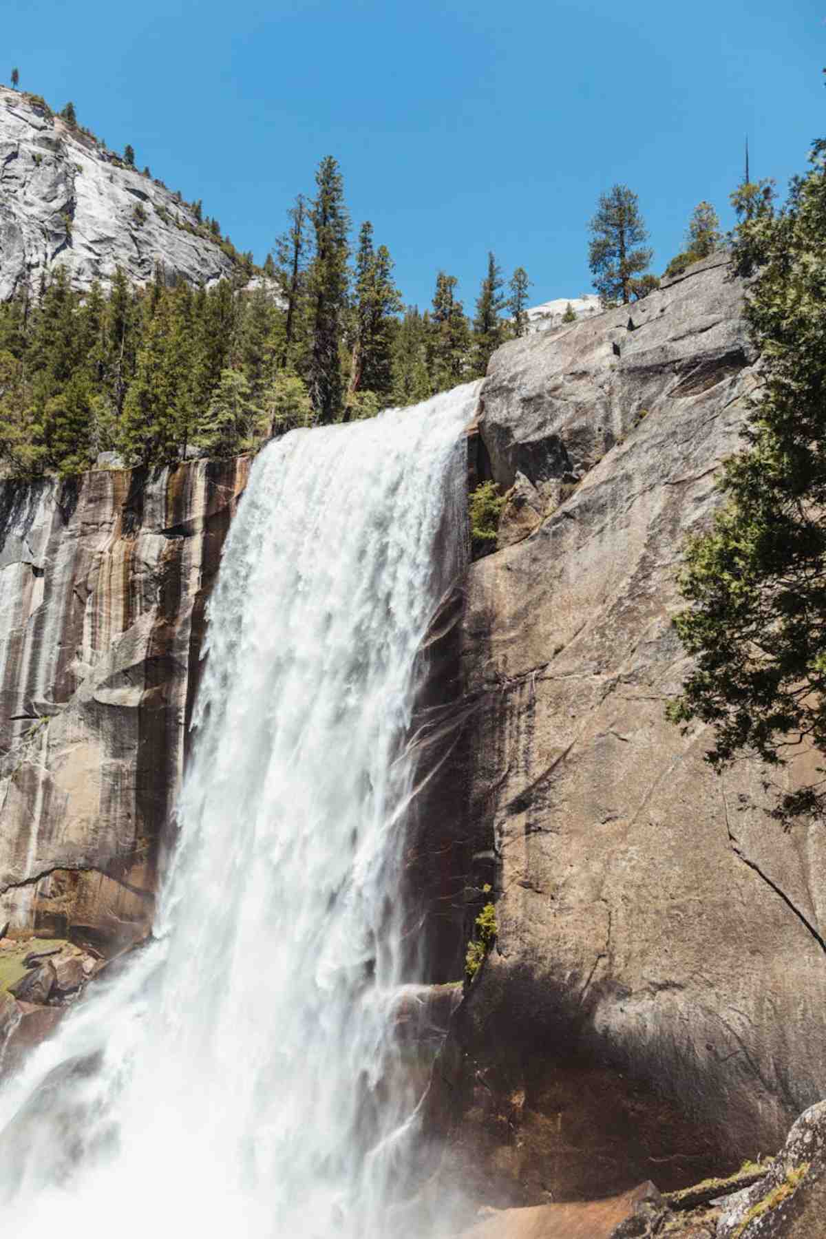 Vernal Falls cascading down rocky cliffs in Yosemite national park