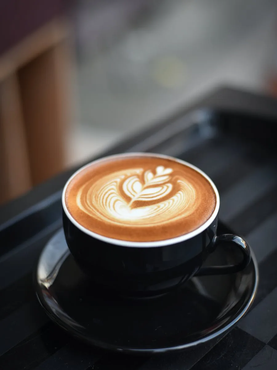 Espresso Bitter vs Sour: What's the Difference and How to Fix It (2026) 4 Espresso bitter vs sour - close-up of espresso shot in white cup on saucer showing crema color and texture