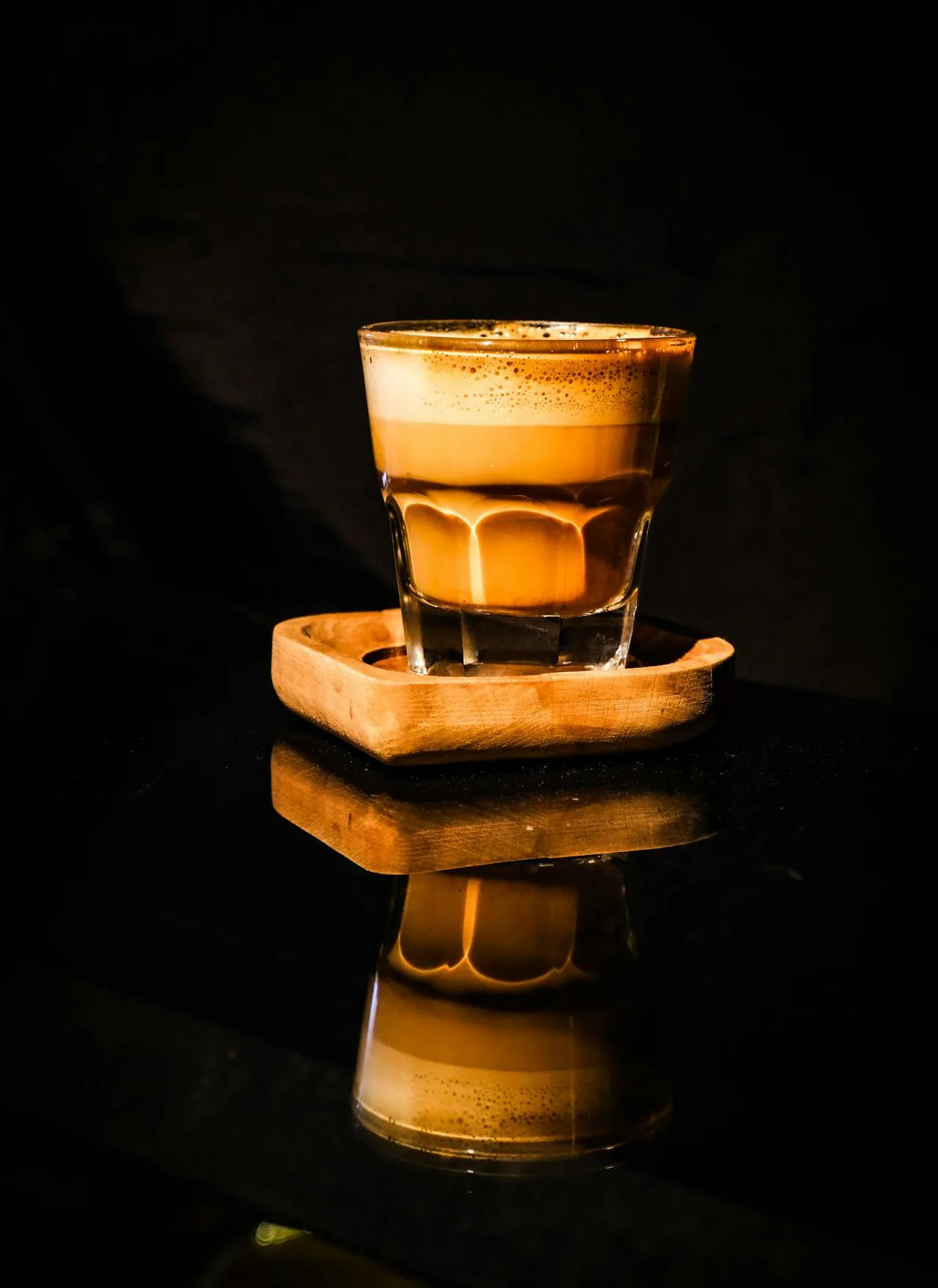 Gibraltar vs Cortado: What's the Difference? (2026) 5 gibraltar coffee vs cortado small espresso drink in glass on wooden coaster