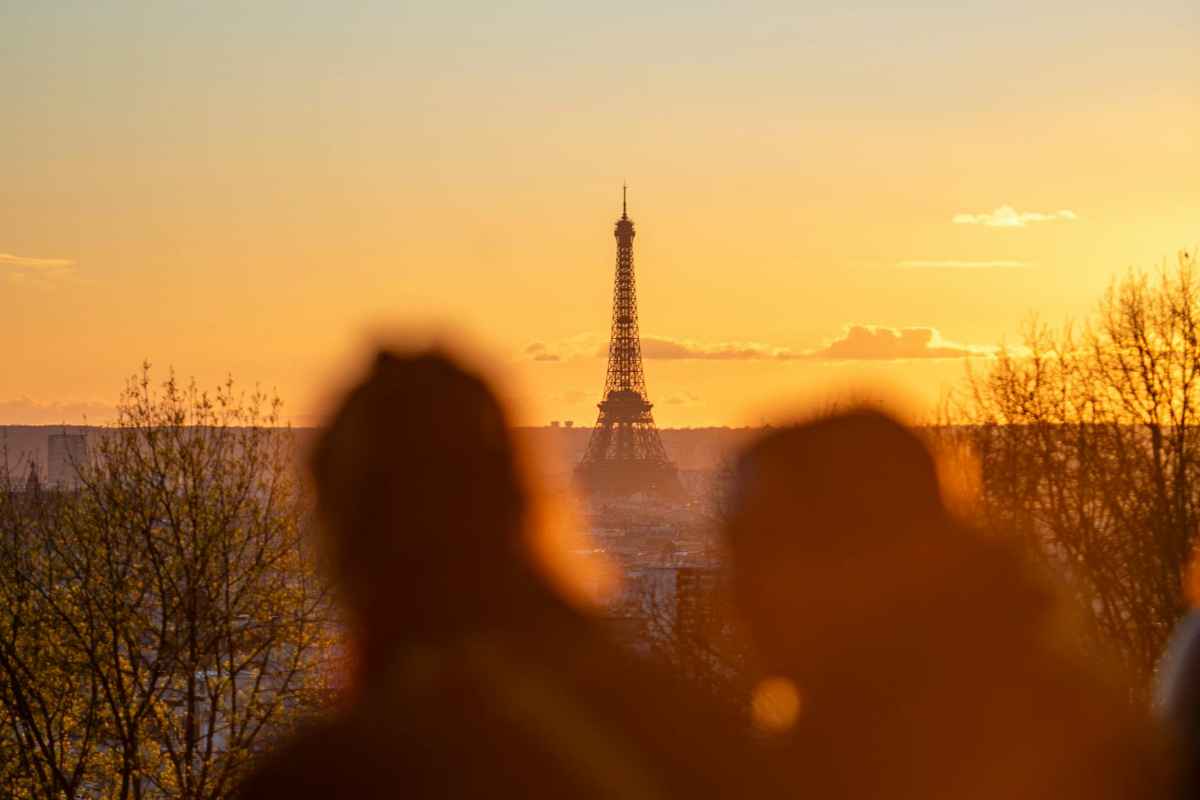 Paris to Mont St Michel Day Trip: An Easy Escape to Wonder 1 A dreamy silhouette of the Eiffel Tower captured at sunset from Montmartre.