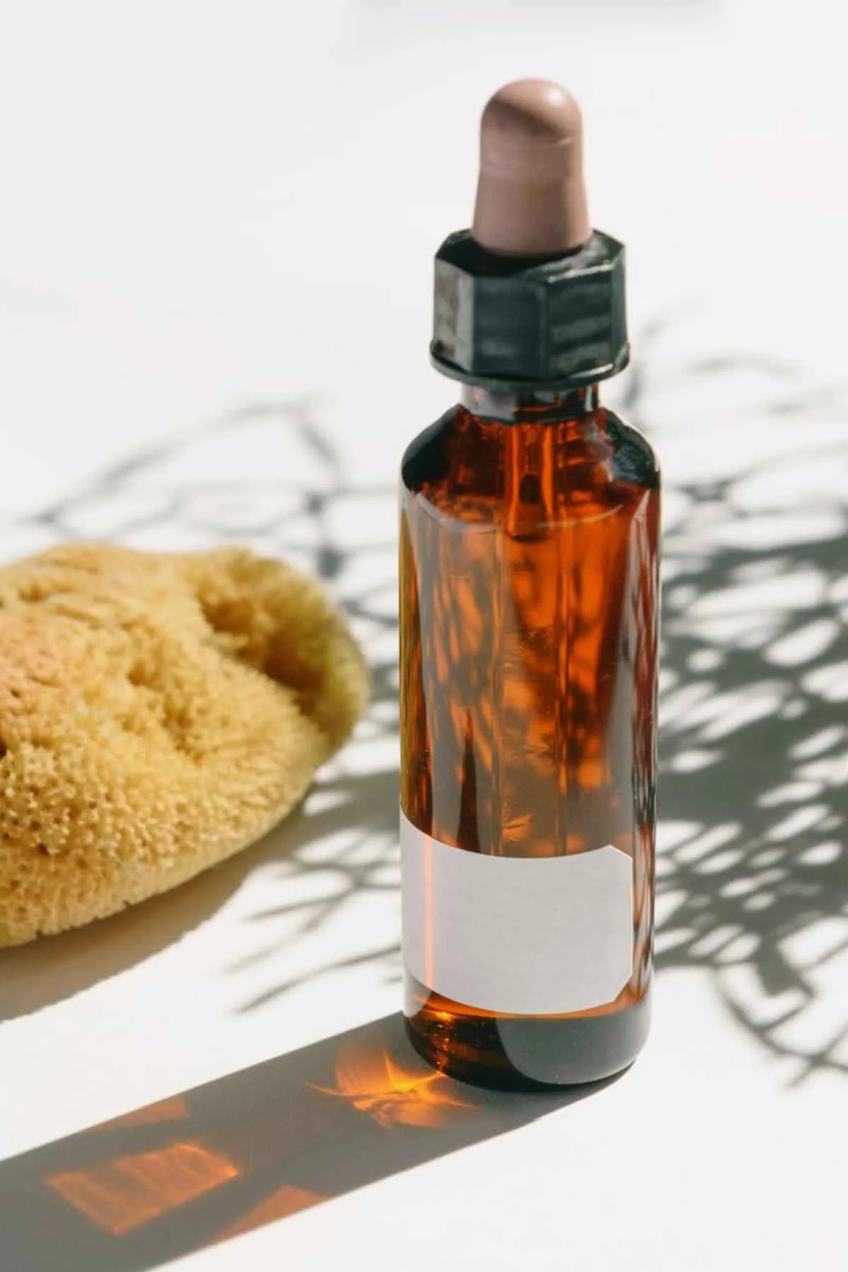 Amber glass dropper bottle with sponge shadows skincare