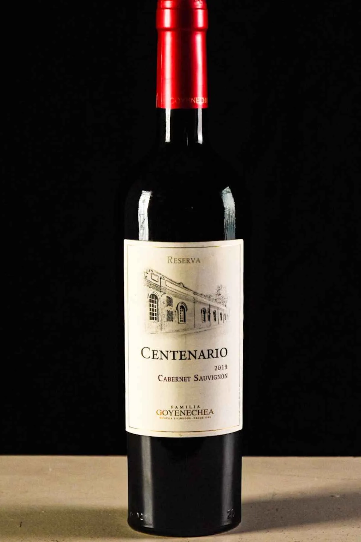 Syrah vs Merlot: Choosing the Perfect Red Wine for You 24 Stylish Cabernet wine bottle on dark background red wine studio