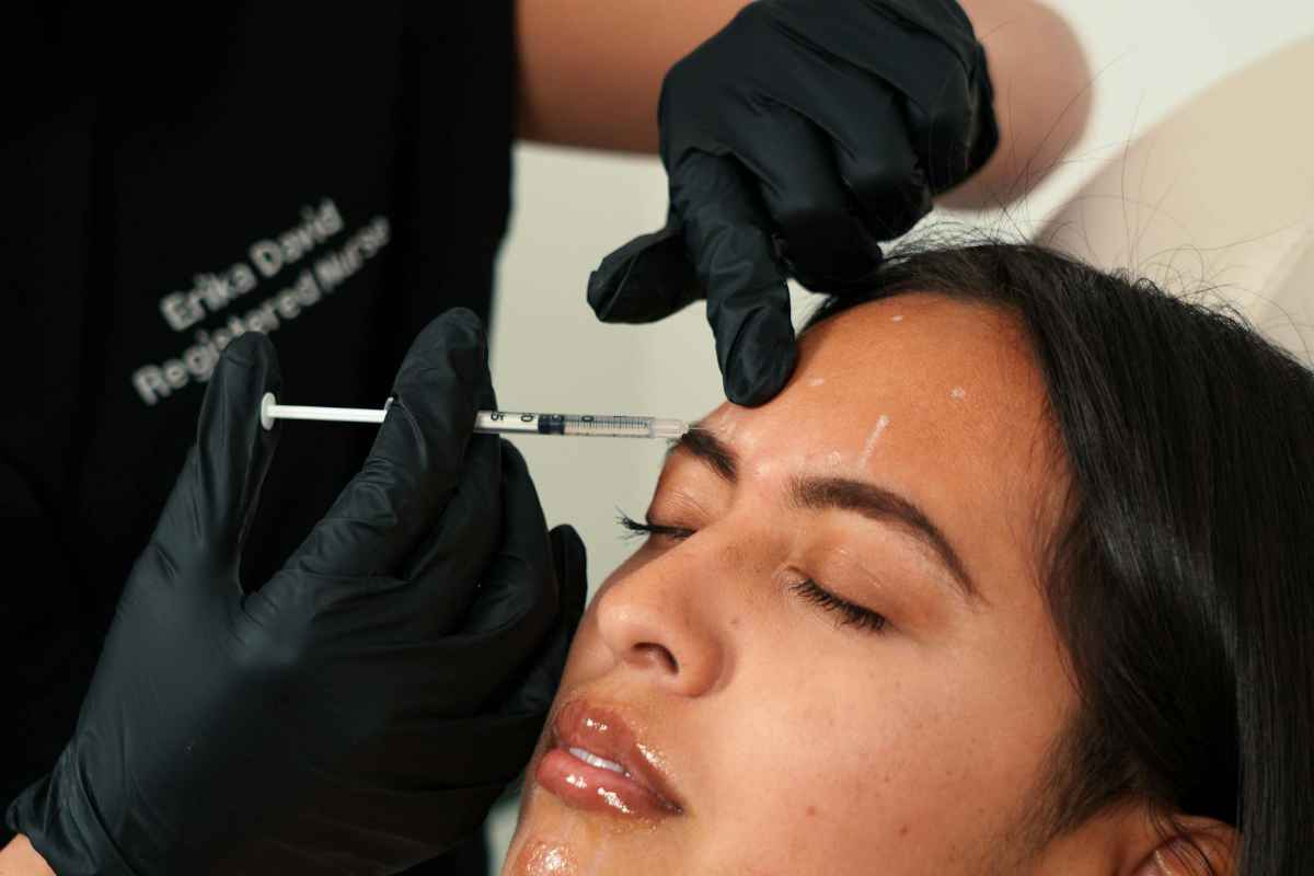 Woman receiving botox injection at a med spa, showcasing a cosmetic procedure.