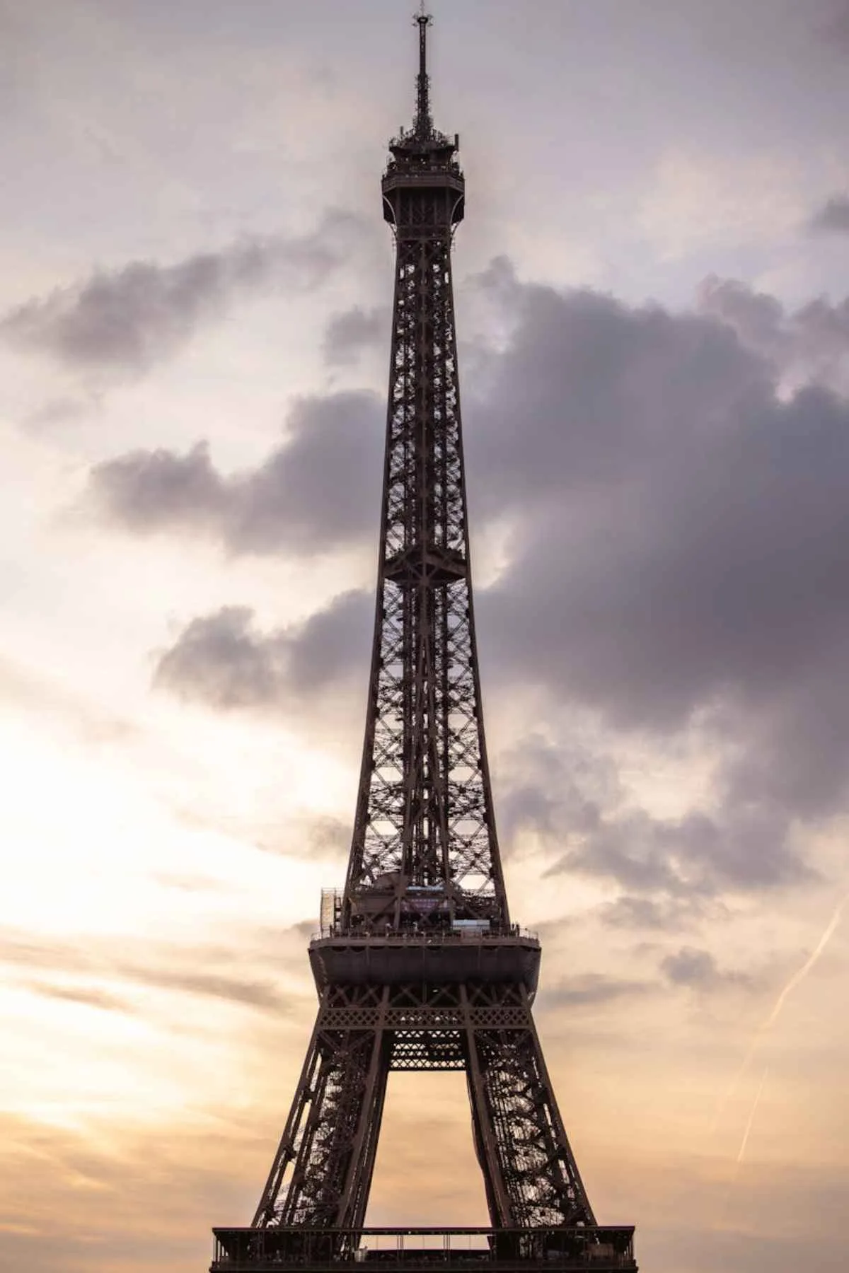Stunning view of the Eiffel Tower silhouetted against a vibrant sunset sky in Paris