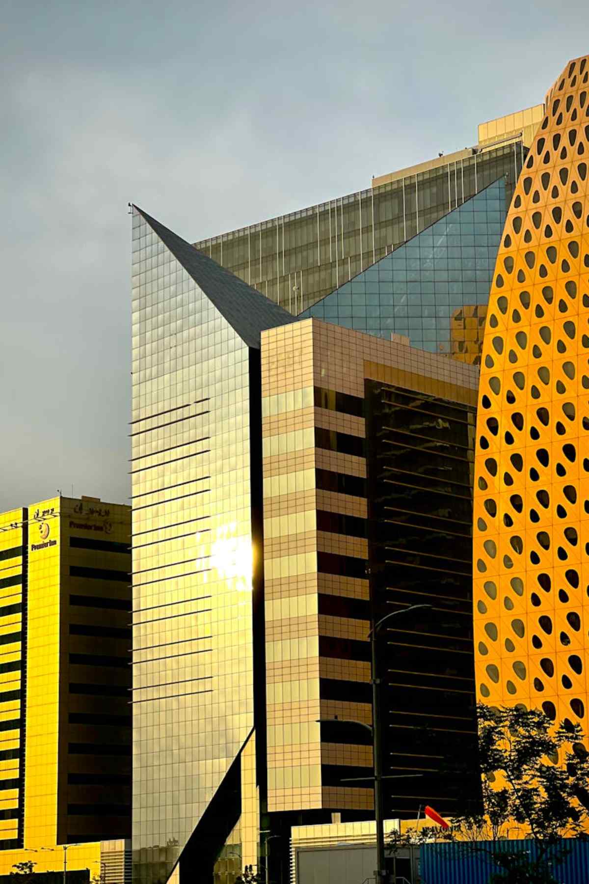 Dramatic shot of modern architecture in Abu Dhabi reflecting sunlight
