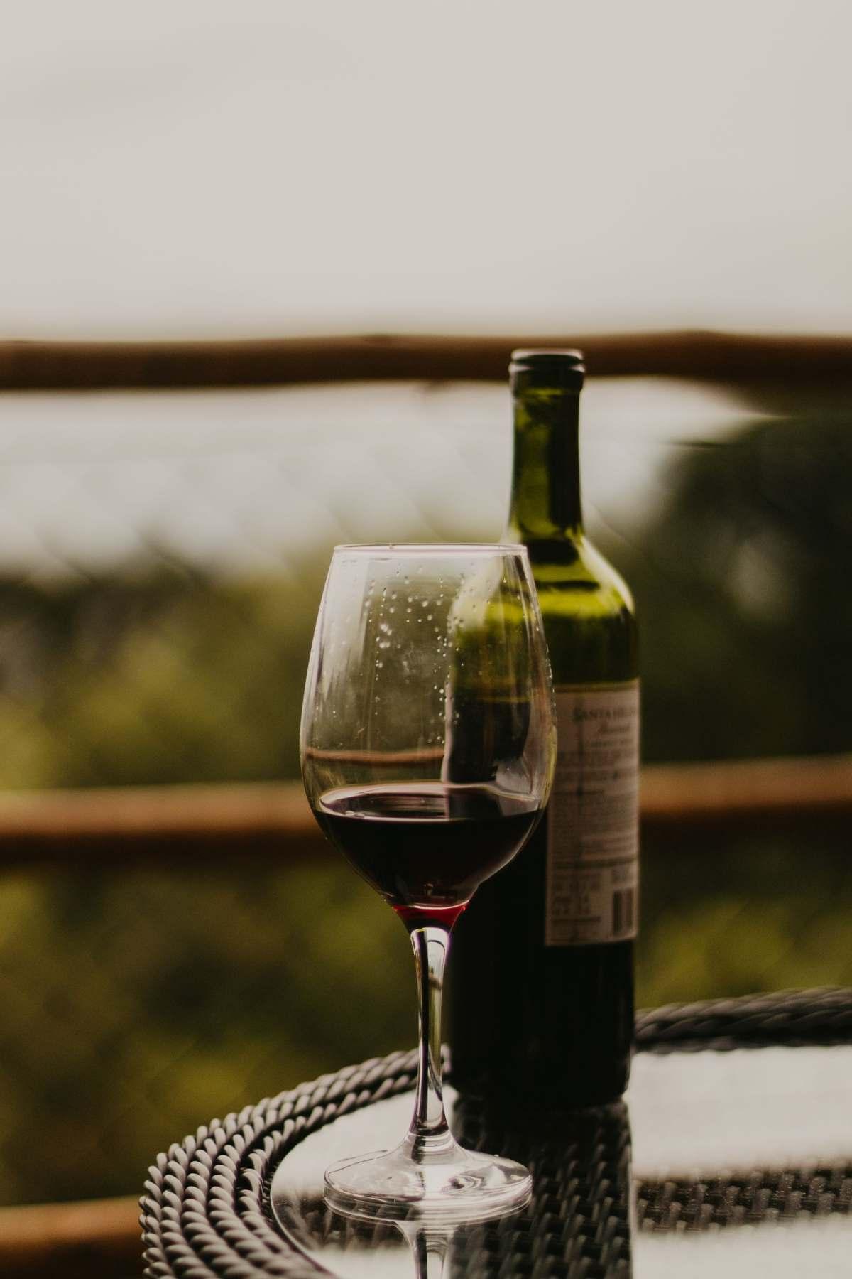 Wineries Springfield MO: Best Local Gems to Visit 20 Wineries Springfield MO guide: glass of red wine and a bottle on an outdoor table