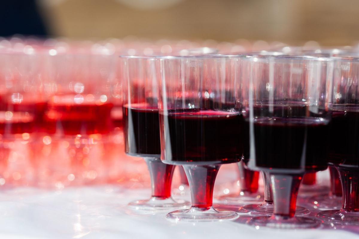 The Complete Guide to Pinot Noir: Taste, Profile, and Pairings 1 Rows of small tasting glasses filled with red wine