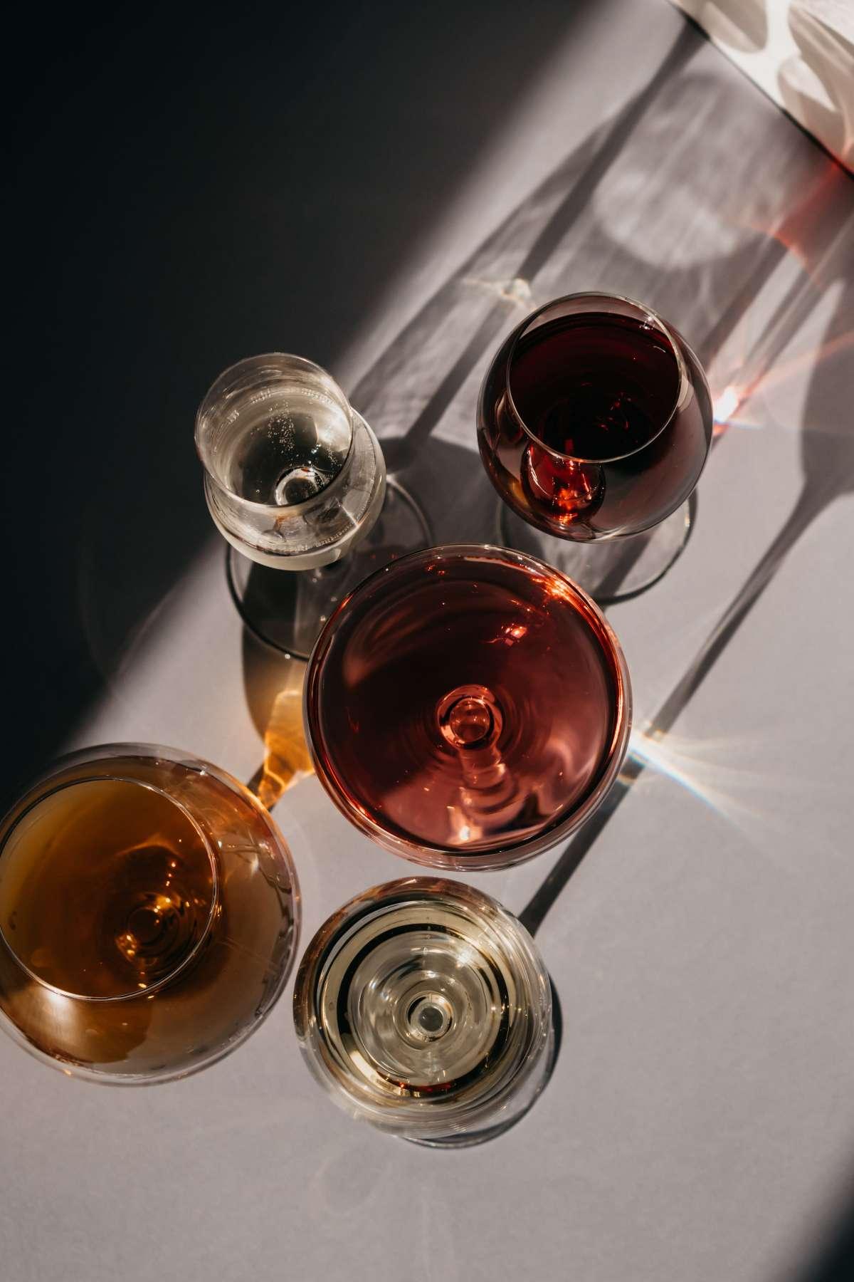 Types of Wine: 5 Main Styles You Need to Know First 15 Overhead view of red, rosé, white and amber wines in glasses on a light table