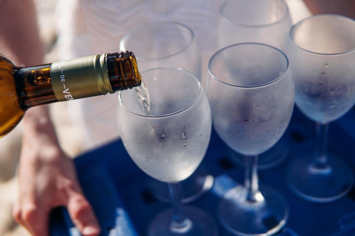 Best Sweet Wine for Beginners: 10 Bottles to Start With 2 Chilled white wine being poured into frosted glasses for a sweet wine tasting