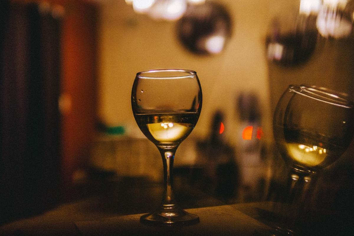 Best Sweet Wine for Beginners: 10 Bottles to Start With 1 Glass of chilled sweet white wine on a wooden table in warm light
